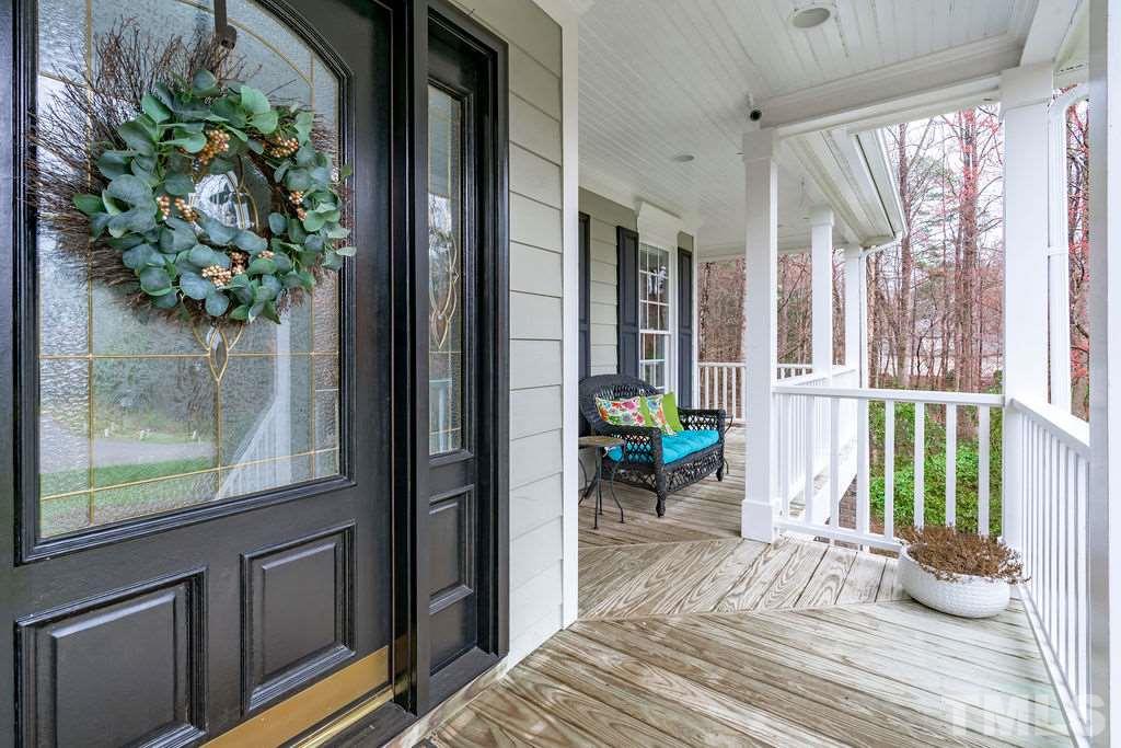 10400 Old Warden Road Raleigh, NC 27615 - Photo 4 of 30 a bed room with a bed and a chair