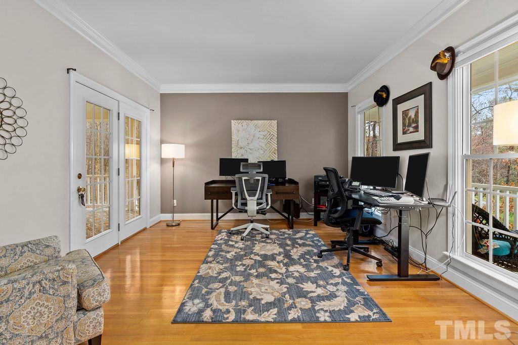10400 Old Warden Road Raleigh, NC 27615 - Photo 8 of 30 a living room with furniture a rug and a flat screen tv