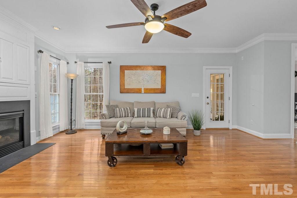 10400 Old Warden Road Raleigh, NC 27615 - Photo 9 of 30 a living room with furniture and a fireplace