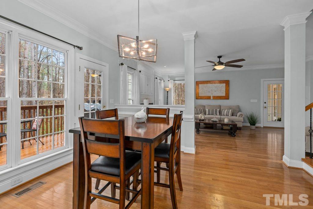 10400 Old Warden Road Raleigh, NC 27615 - Photo 10 of 30 a view of a dining room with furniture window and wooden floor