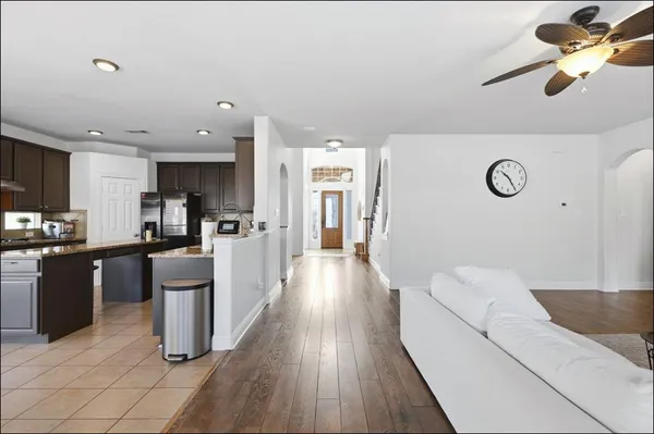 a large white kitchen with a large window