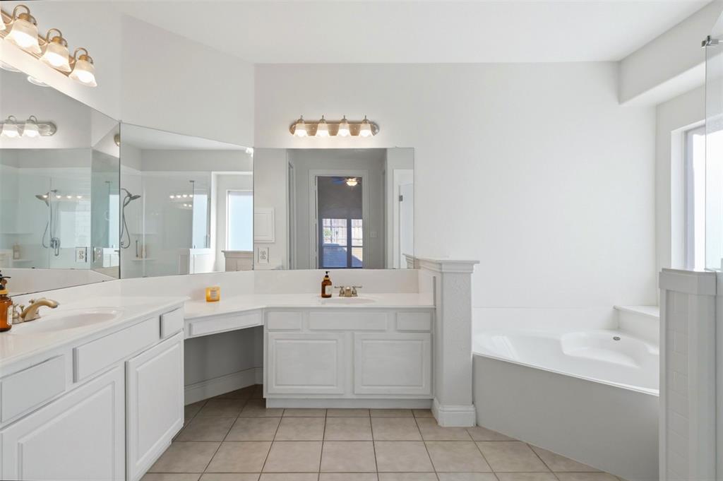 1905 Natchez Trace Allen, TX 75013 - Photo 13 of 26 a view of a double vanity sink mirror and cabinets