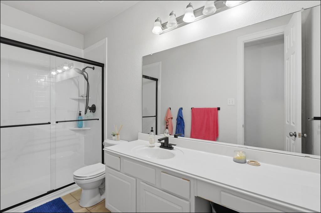 1905 Natchez Trace Allen, TX 75013 - Photo 16 of 26 a bathroom with a sink and a mirror