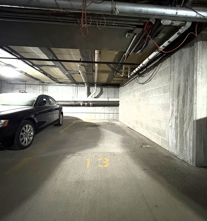 28 Parkman Street, Unit 2 Brookline, MA 02446 - Photo 11 of 11 a view of parking garage with cars