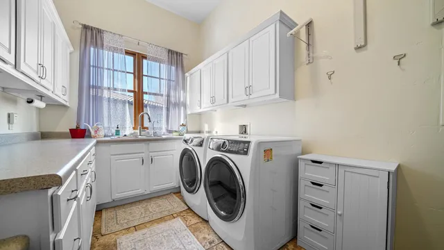 a spacious bedroom with a bed mirror on desk and a wooden floor