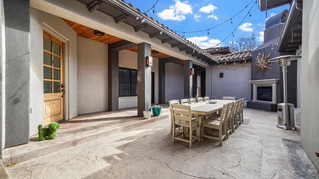 a view of a dining room with furniture and chandelier