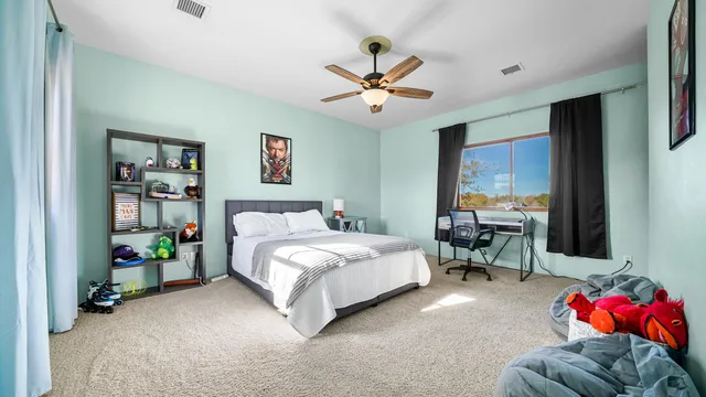 a bathroom with a sink a toilet a mirror a bathtub and shower