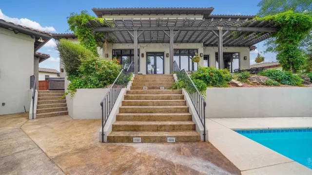 a view of a table and chairs under an umbrella