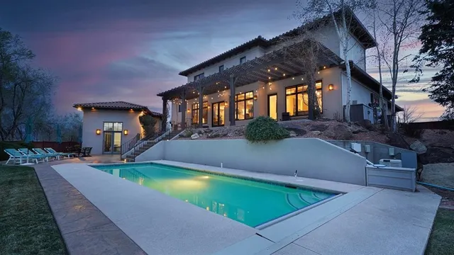 a view of a house with a yard and sitting area
