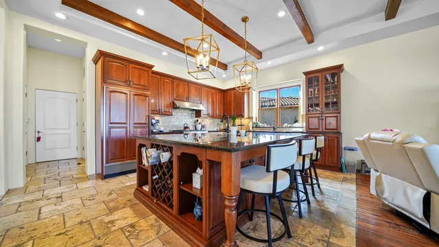 a kitchen with stainless steel appliances granite countertop a sink and cabinets