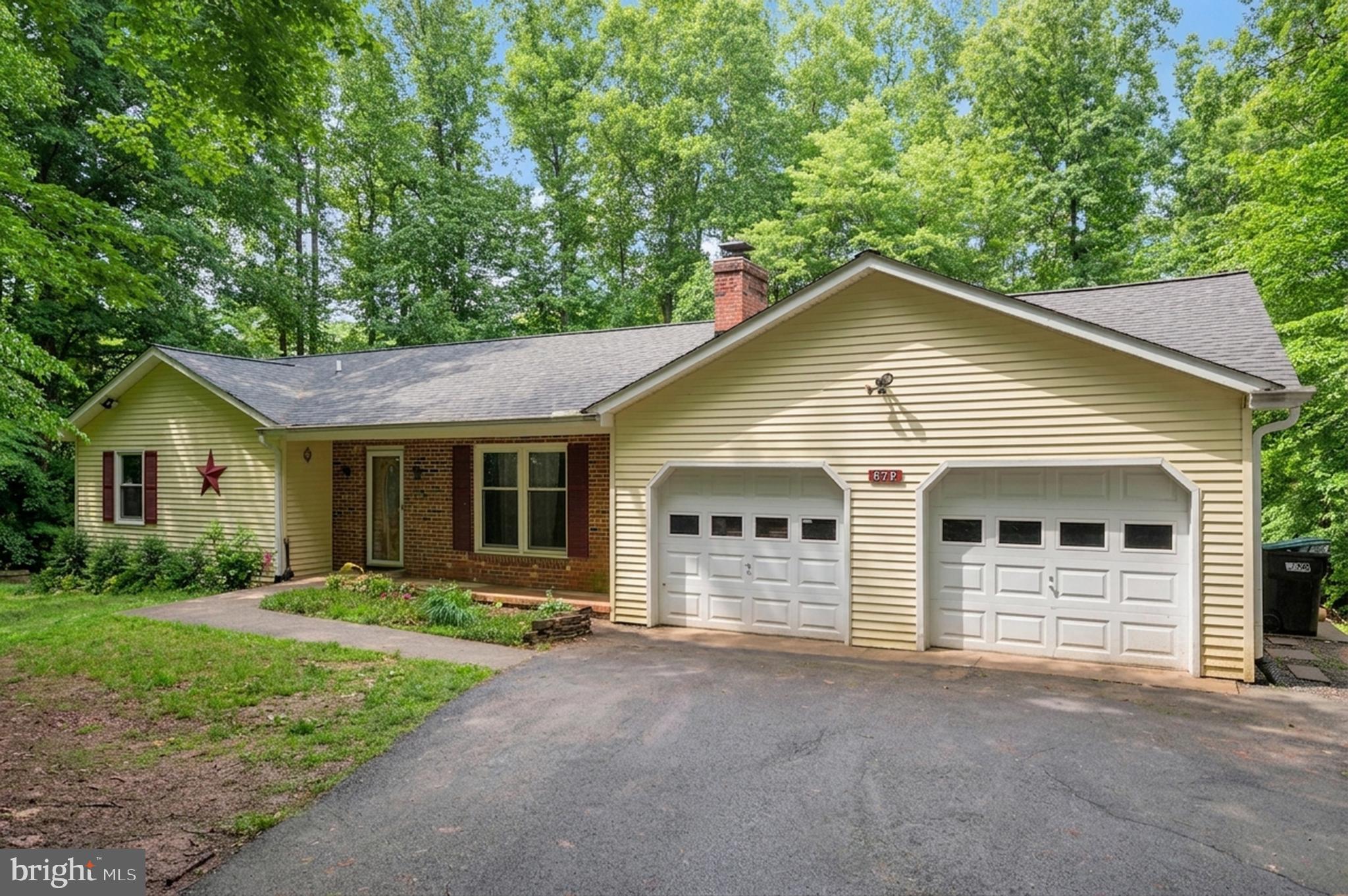 679 Cropp Road Fredericksburg, VA 22406 - Photo 4 of 39 a view of house with backyard and garden