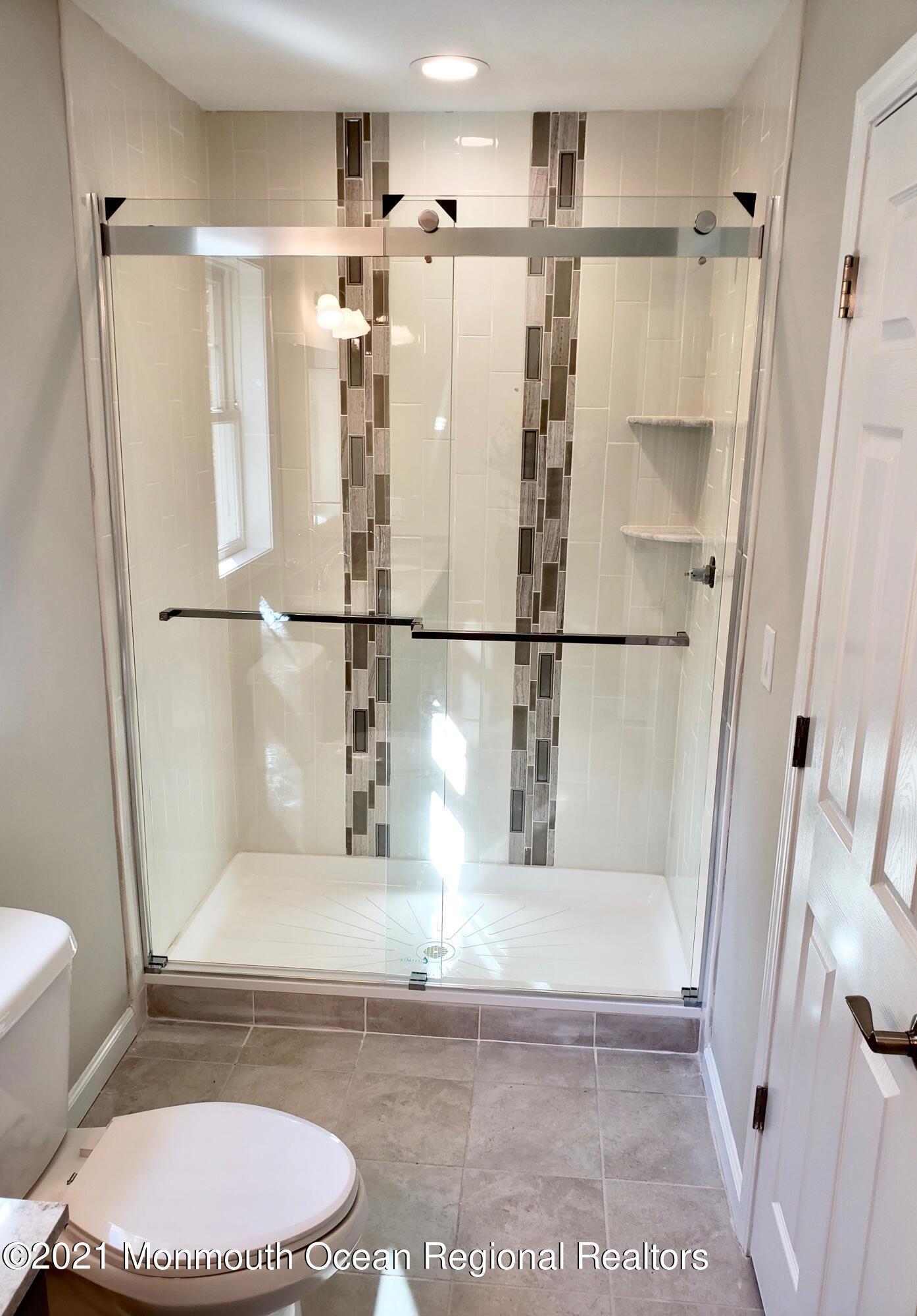 154 Jackson Mills Road Freehold, NJ 07728 - Photo 13 of 19 a bathroom with a tub toilet and a sink