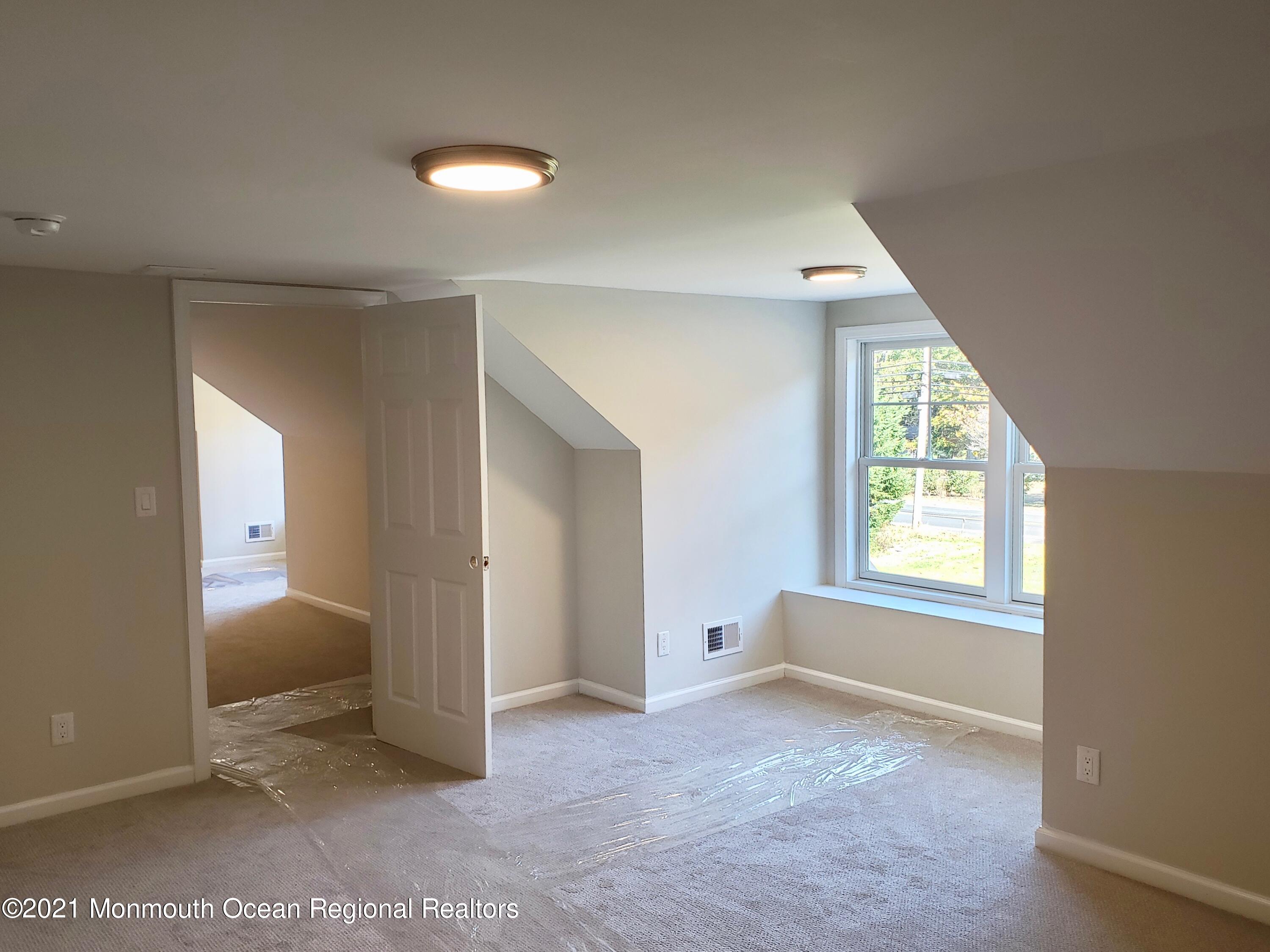 154 Jackson Mills Road Freehold, NJ 07728 - Photo 17 of 19 an empty room with windows and closet