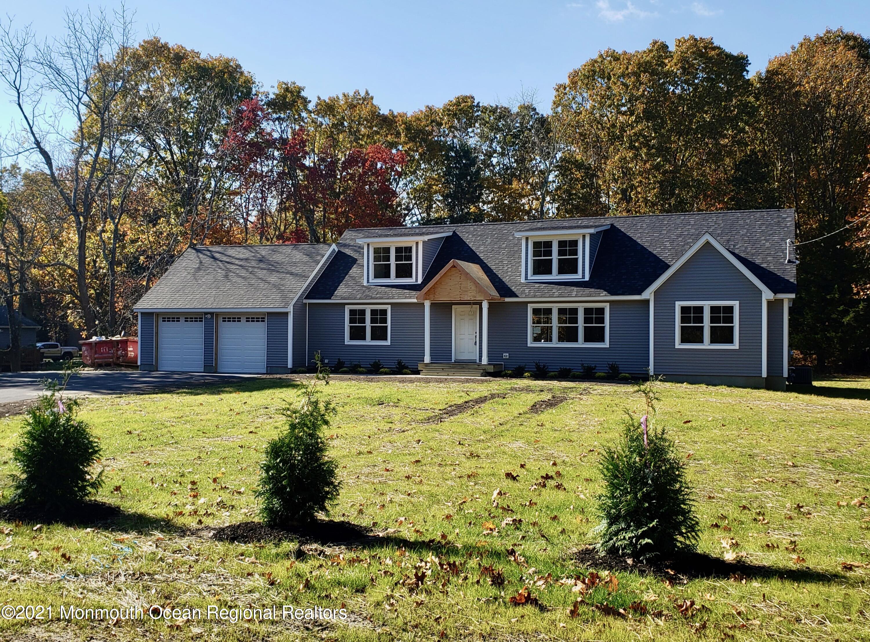 154 Jackson Mills Road Freehold, NJ 07728 - Photo 6 of 19 a front view of a house with a yard