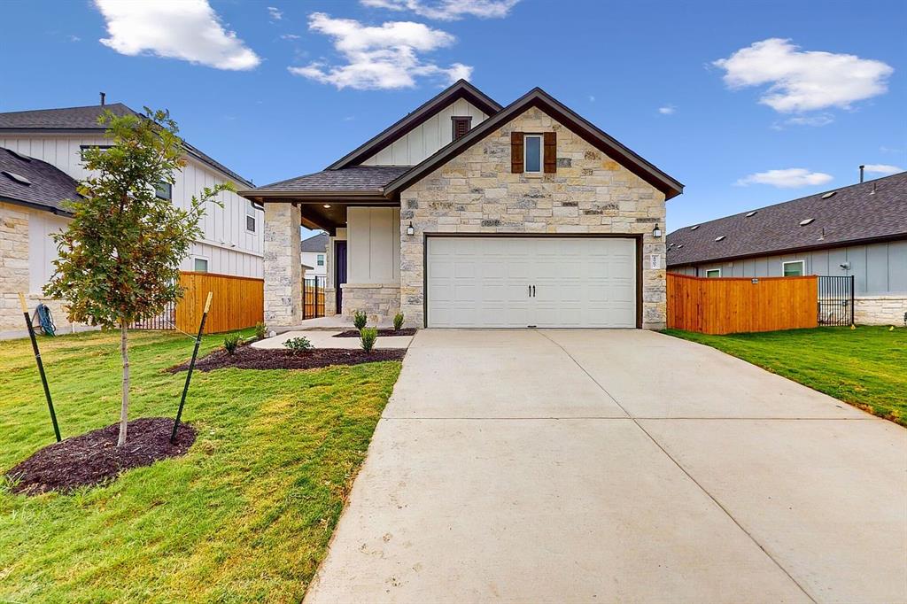 4907 Escape Rivera Drive Austin, TX 78747 - Photo 1 of 28 A charming single-story residence boasts an attached garage and a neatly landscaped front yard with a concrete driveway.