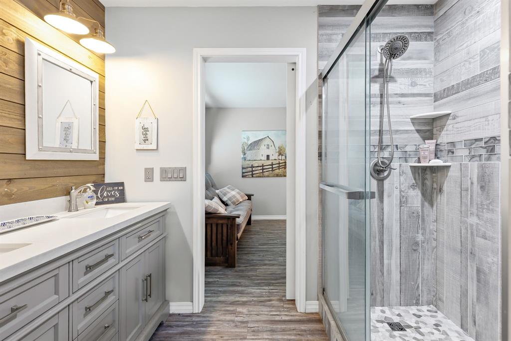1094 Southwest Sw Cr Saltillo, TX 75478 - Photo 14 of 39 a bathroom with a double vanity sink and mirror