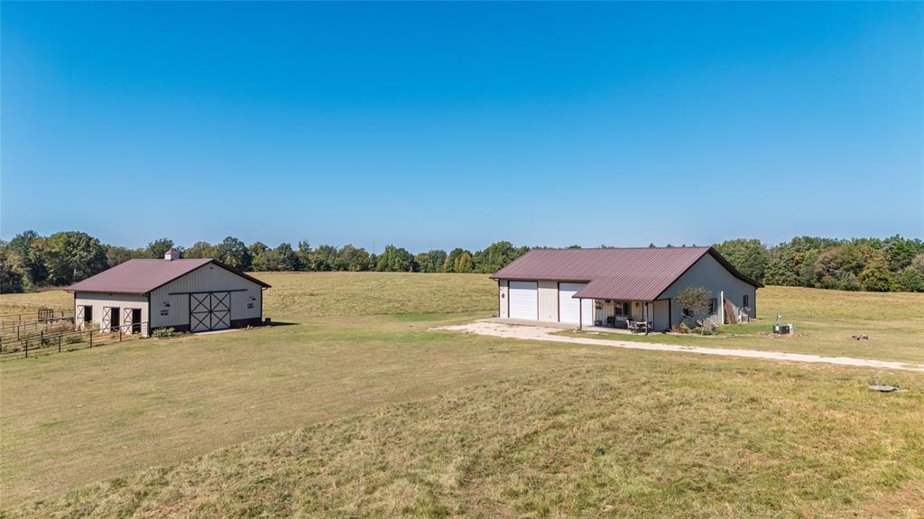 1094 Southwest Sw Cr Saltillo, TX 75478 - Photo 5 of 39 a view of a lake with a house in the background