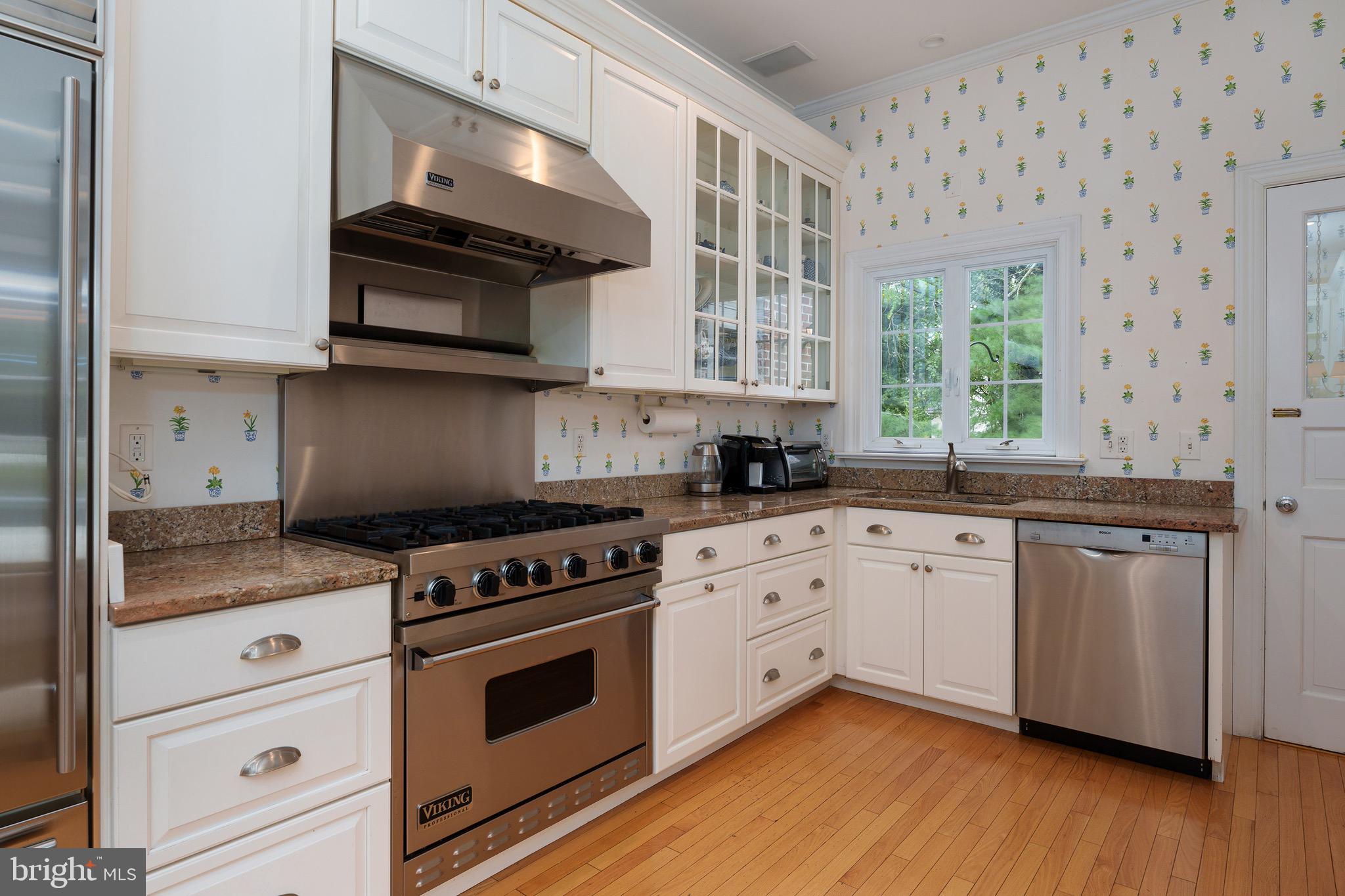 21 Russell Road Princeton, NJ 08540 - Photo 14 of 50 a kitchen with stainless steel appliances granite countertop a stove a sink and a microwave