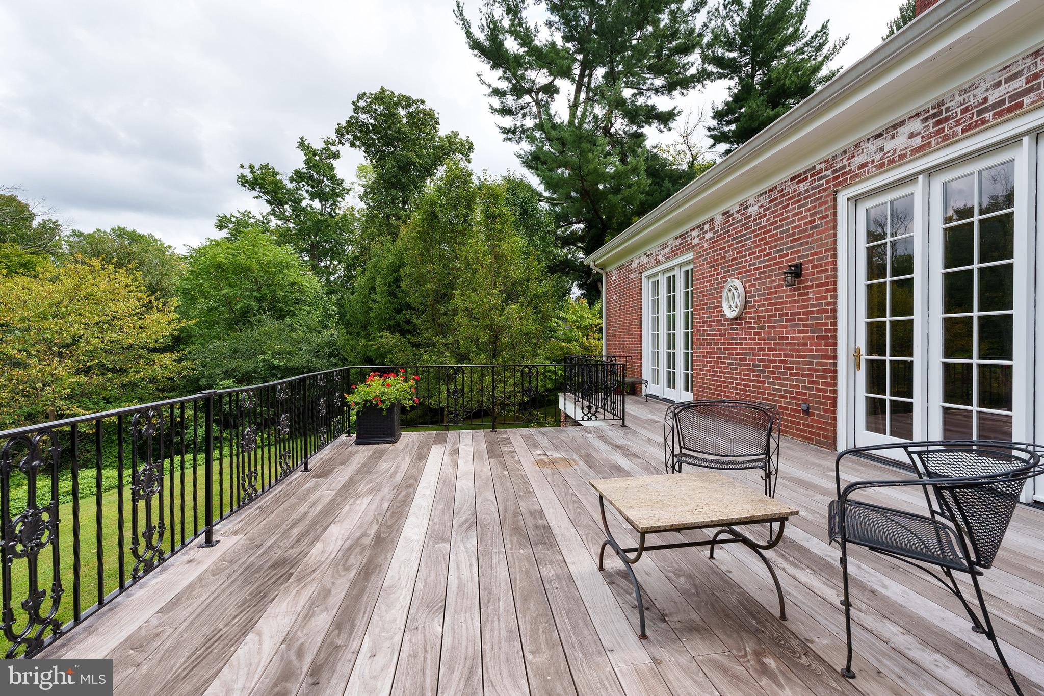 21 Russell Road Princeton, NJ 08540 - Photo 21 of 50 a view of a patio with a table and chairs