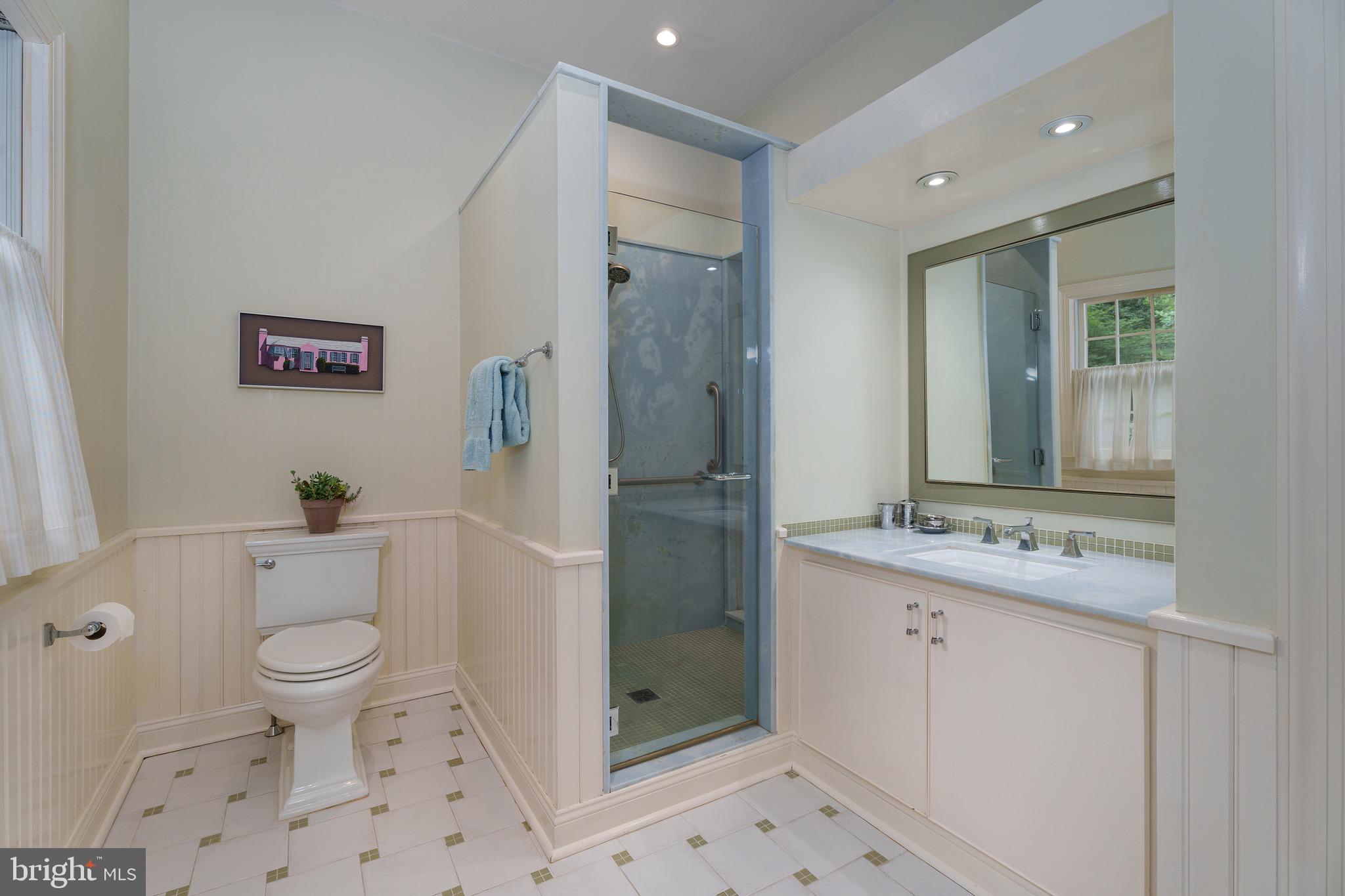 21 Russell Road Princeton, NJ 08540 - Photo 28 of 50 a bathroom with a granite countertop sink toilet and shower