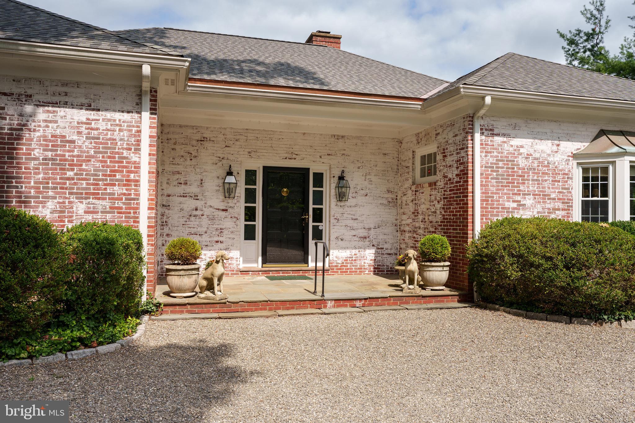 21 Russell Road Princeton, NJ 08540 - Photo 3 of 50 a building with a table and chairs in front of door