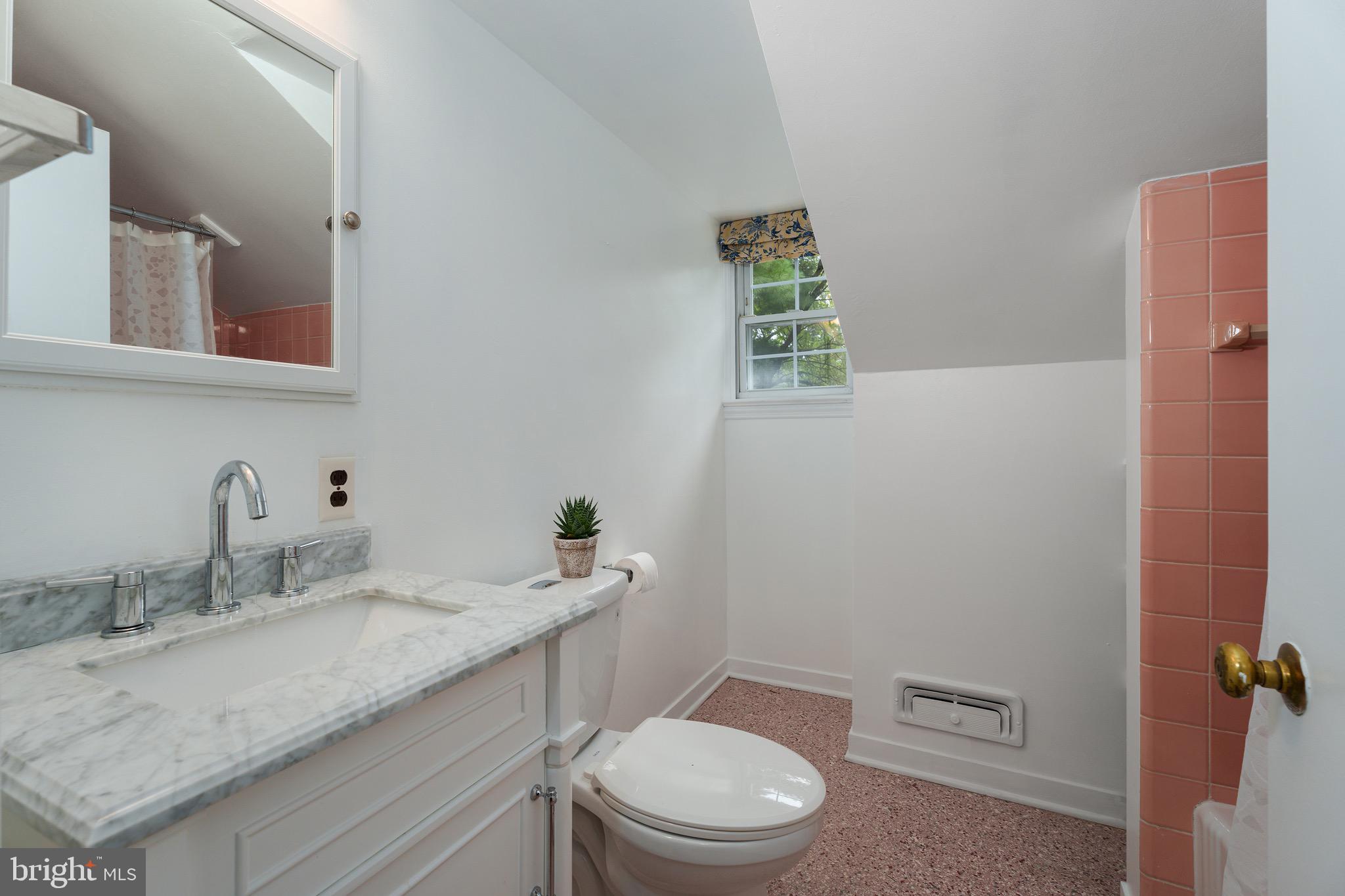 21 Russell Road Princeton, NJ 08540 - Photo 49 of 50 a bathroom with a granite countertop toilet sink and mirror