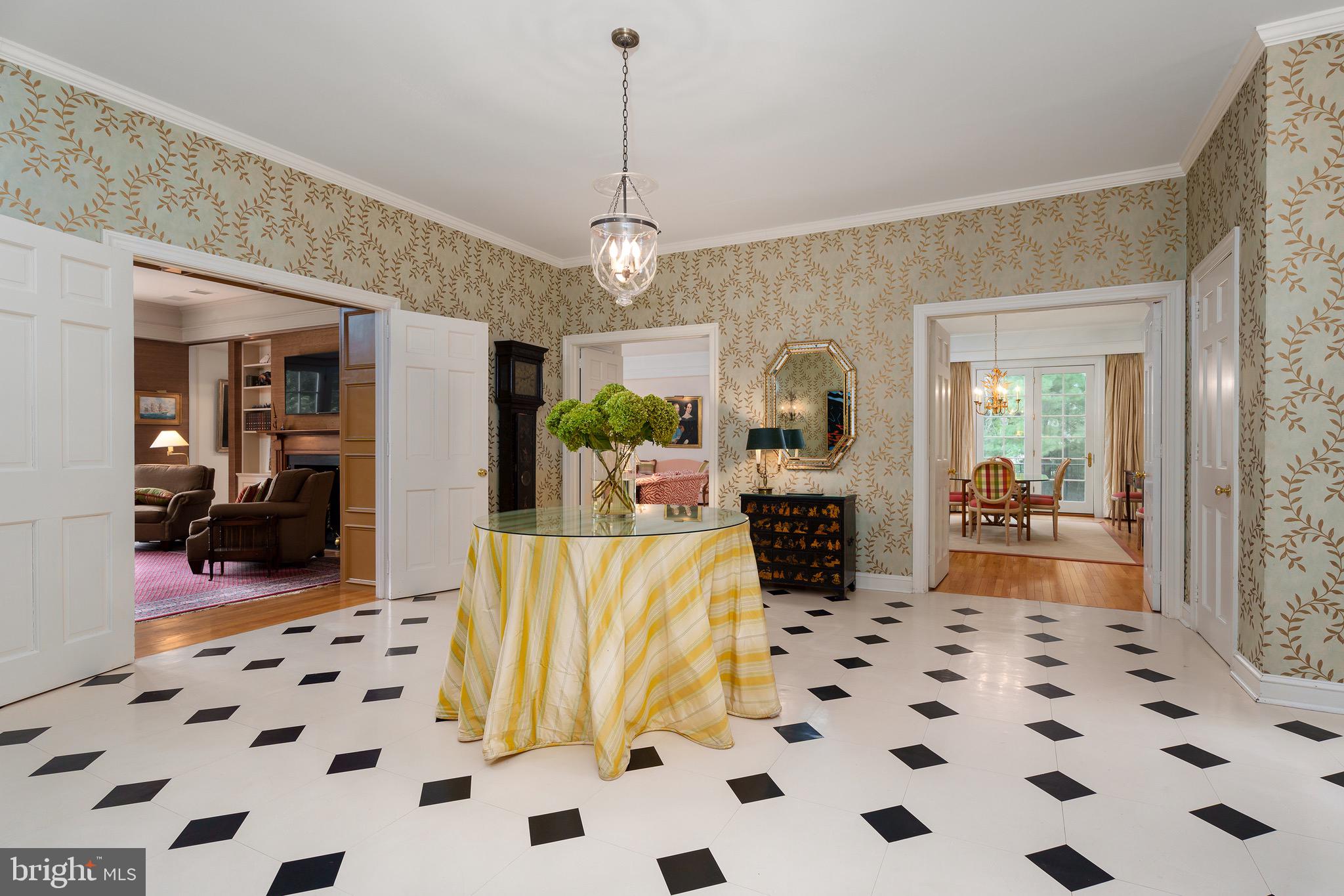 21 Russell Road Princeton, NJ 08540 - Photo 5 of 50 a view of a hallway with a dining table and a chandelier