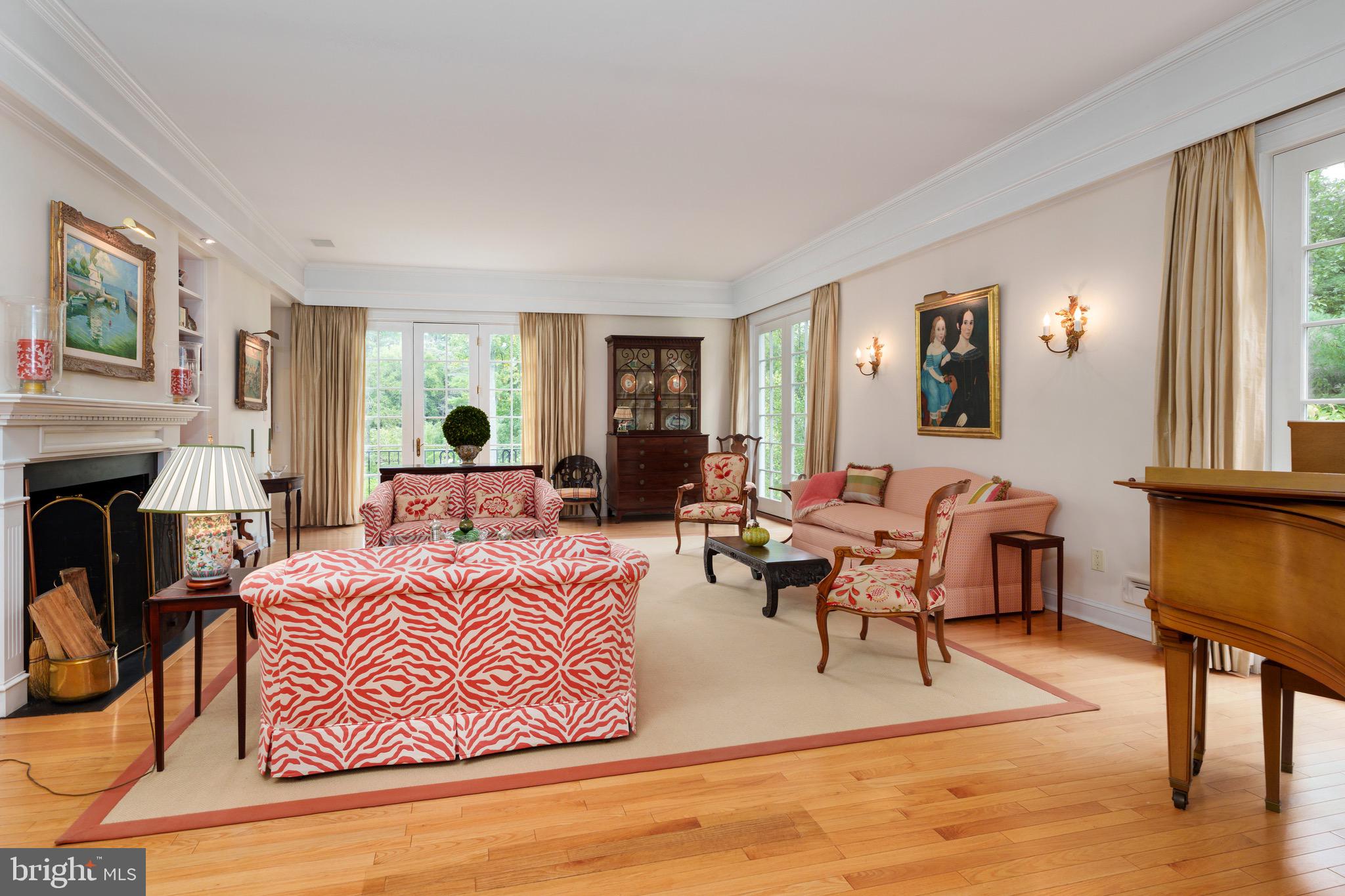 21 Russell Road Princeton, NJ 08540 - Photo 8 of 50 a living room with furniture a fireplace and paintings on the wall