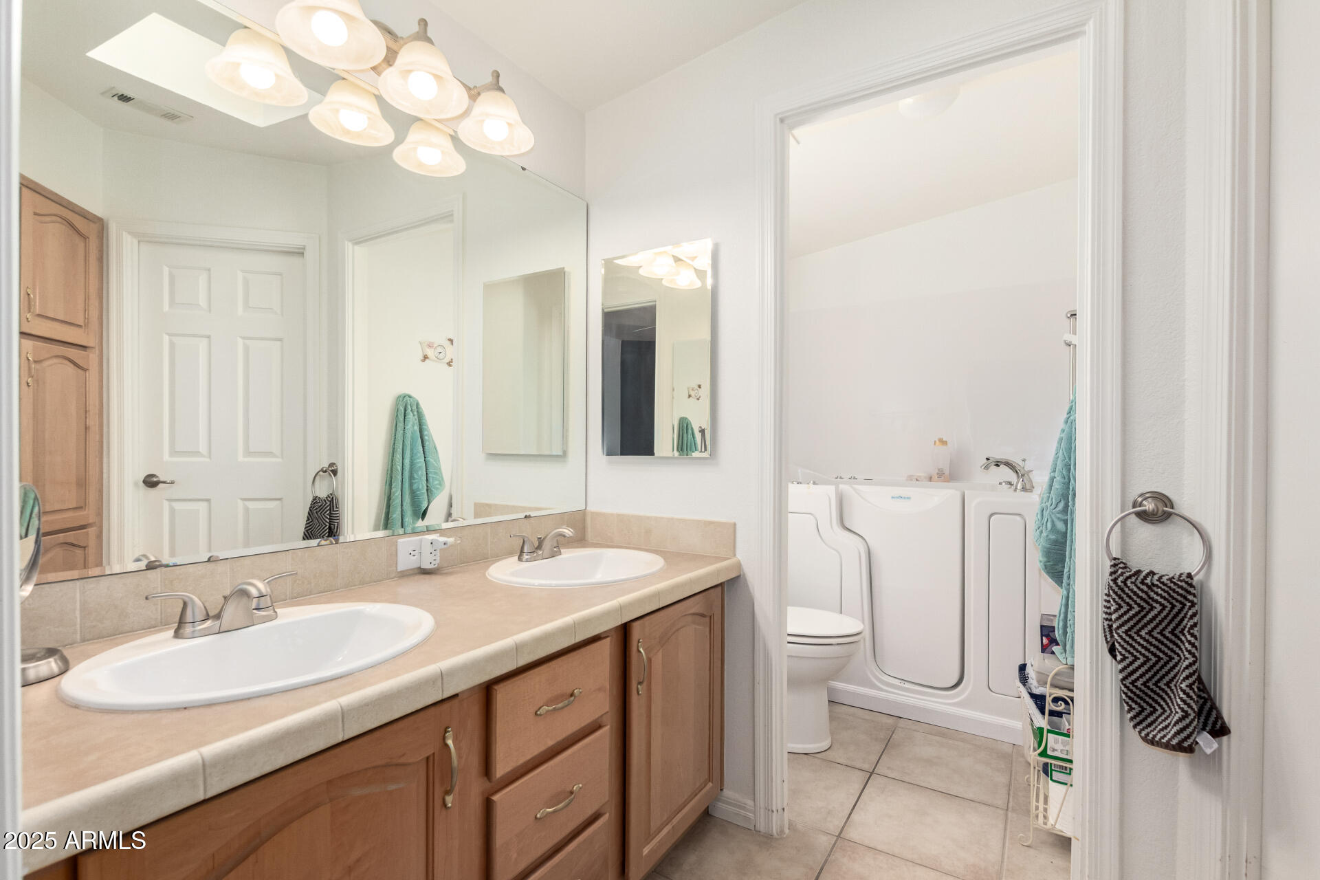 3301 South Goldfield Road, Unit 2097 Apache Junction, AZ 85119 - Photo 13 of 40 a bathroom with a double vanity sink and a mirror