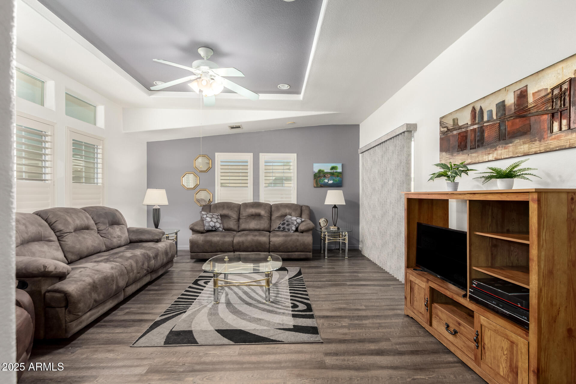 3301 South Goldfield Road, Unit 2097 Apache Junction, AZ 85119 - Photo 2 of 40 a living room with furniture and a flat screen tv