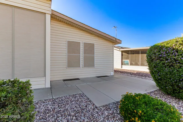 a view of house with backyard