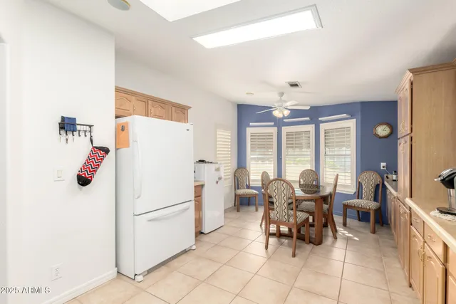 a white refrigerator freezer sitting inside of a kitchen
