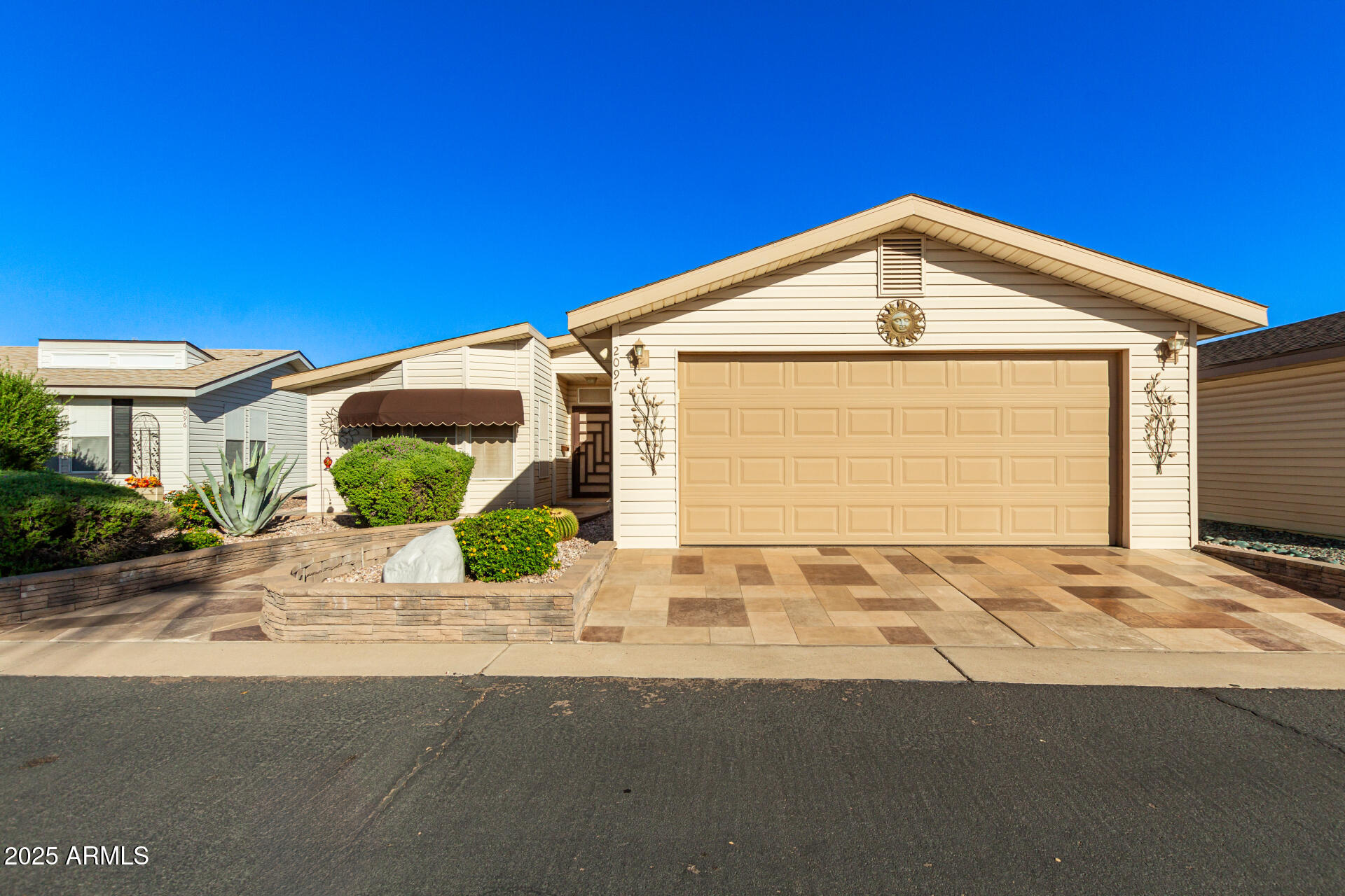 3301 South Goldfield Road, Unit 2097 Apache Junction, AZ 85119 - Photo 39 of 40 a front view of a house with a yard