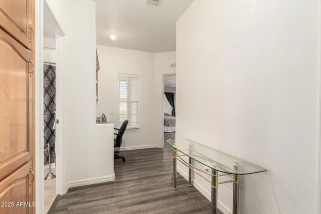 a view of entryway with wooden floor and stairs