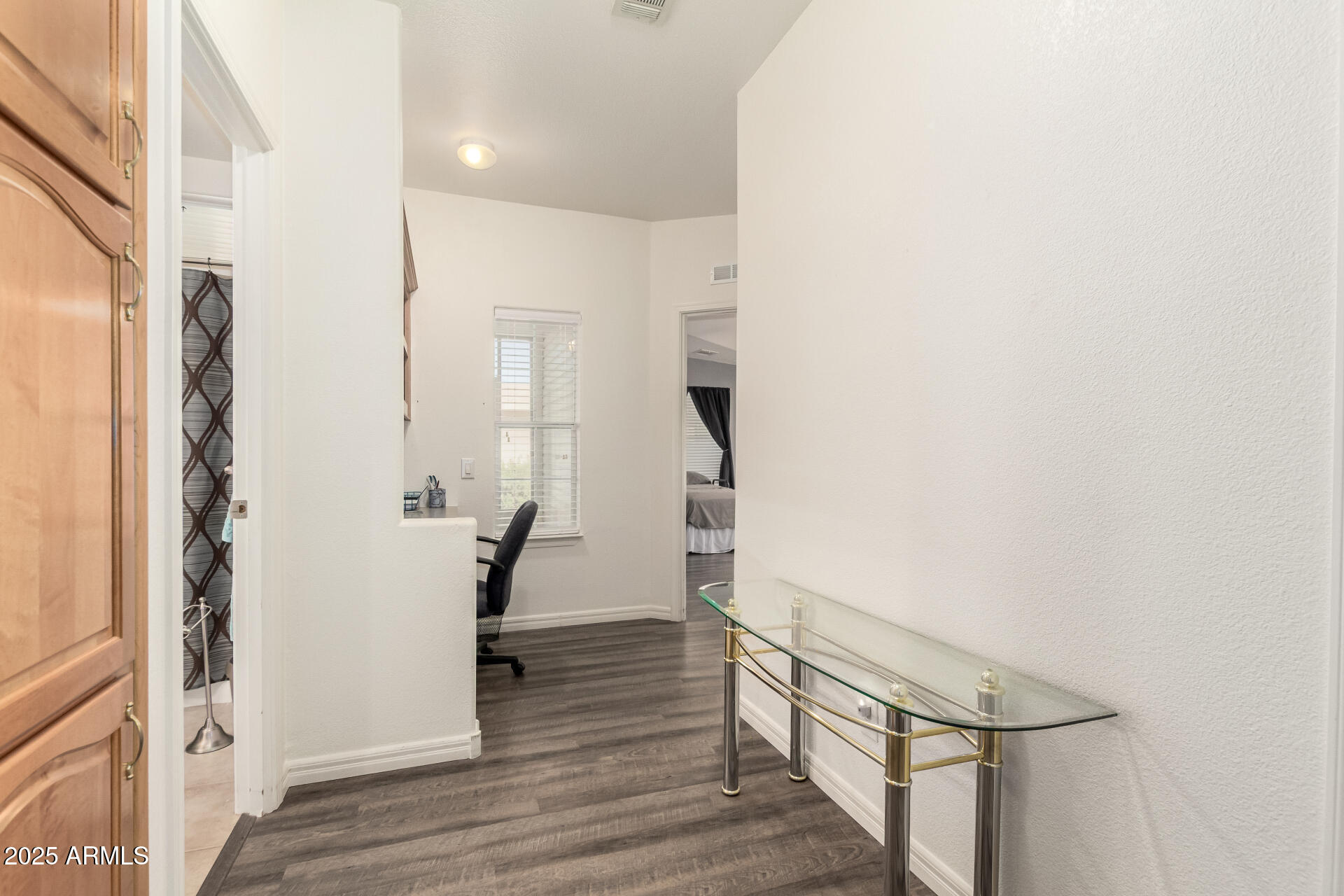 3301 South Goldfield Road, Unit 2097 Apache Junction, AZ 85119 - Photo 4 of 40 a view of entryway with wooden floor and stairs