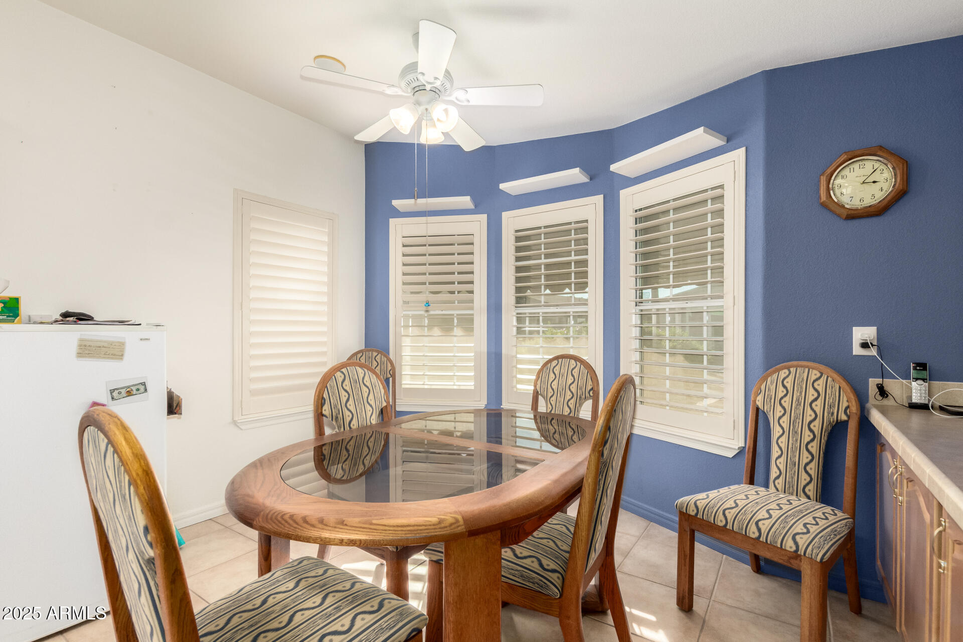 3301 South Goldfield Road, Unit 2097 Apache Junction, AZ 85119 - Photo 9 of 40 a view of a dining room with furniture and chandelier