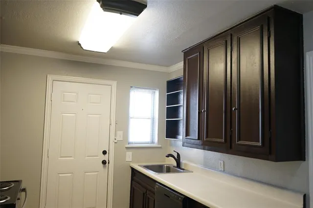 a bathroom with a sink and a large mirror