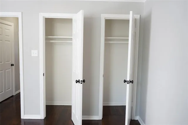 a view of bathroom with a sink and mirror