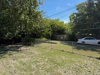 502 Northeast 19th Street Grand Prairie, TX 75050 - Photo 6 of 30 a view of a swimming pool with a yard