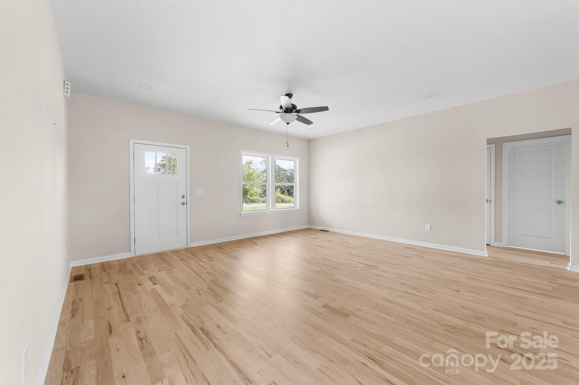 6203 Flay Road Cherryville, NC 28021 - Photo 13 of 34 wooden floor in an empty room with a window