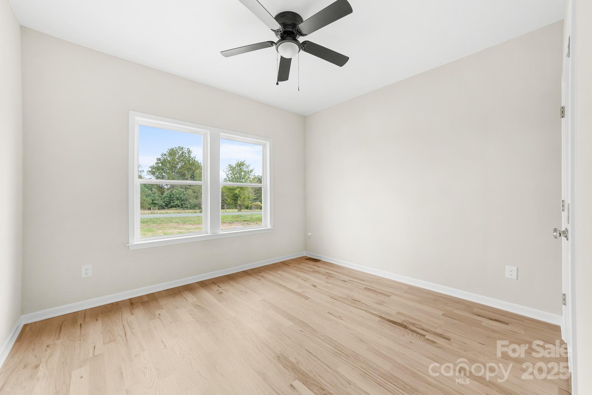 6203 Flay Road Cherryville, NC 28021 - Photo 27 of 34 a view of a room with a window and a ceiling fan