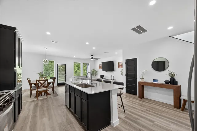 a bathroom with a toilet a sink and a mirror