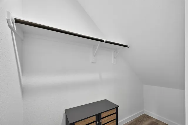 a view of an empty walk in closet