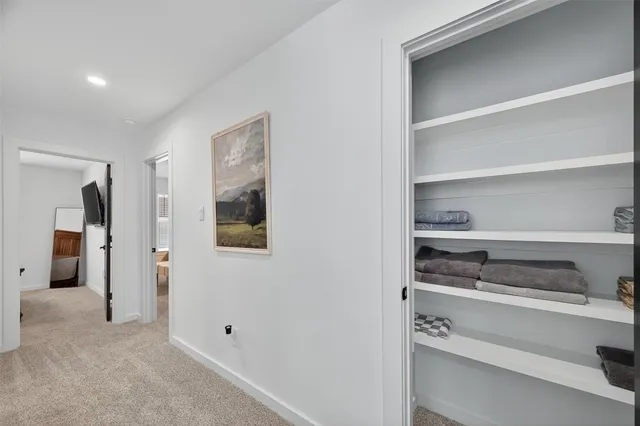 a bathroom with a sink vanity mirror and toilet