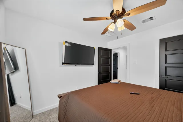 a bathroom with a double vanity sink a mirror and a shower