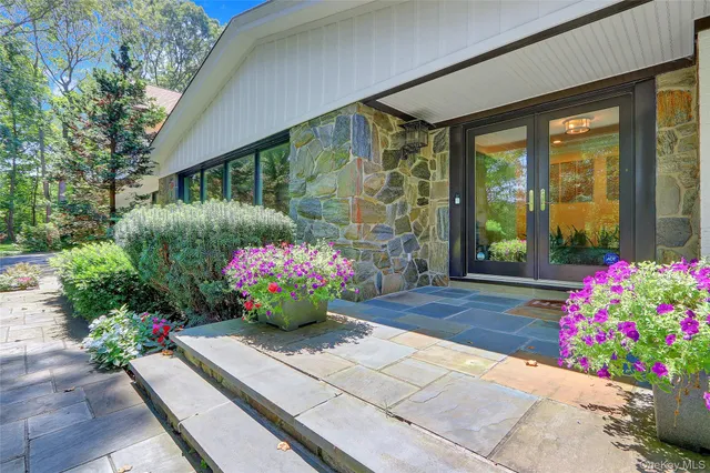 a flower pot with a table and chairs