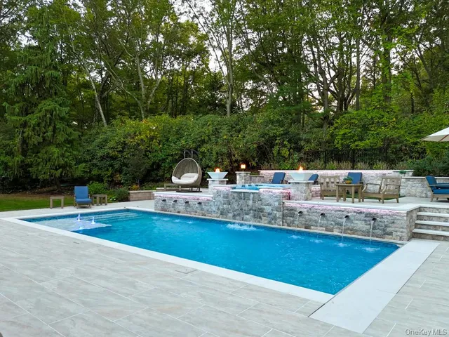 a view of a swimming pool with a yard