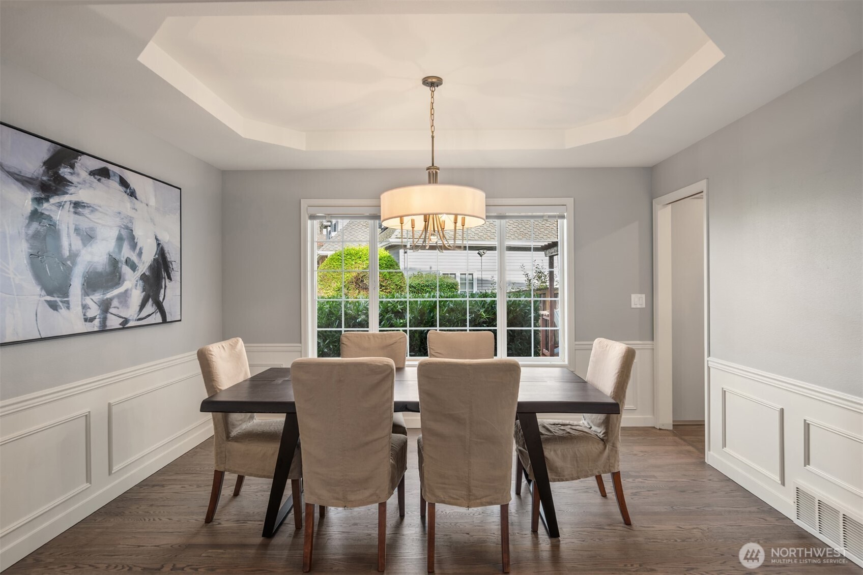 10330 Northeast 151st Place Bothell, WA 98011 - Photo 7 of 38 a dining room with furniture a chandelier and wooden floor