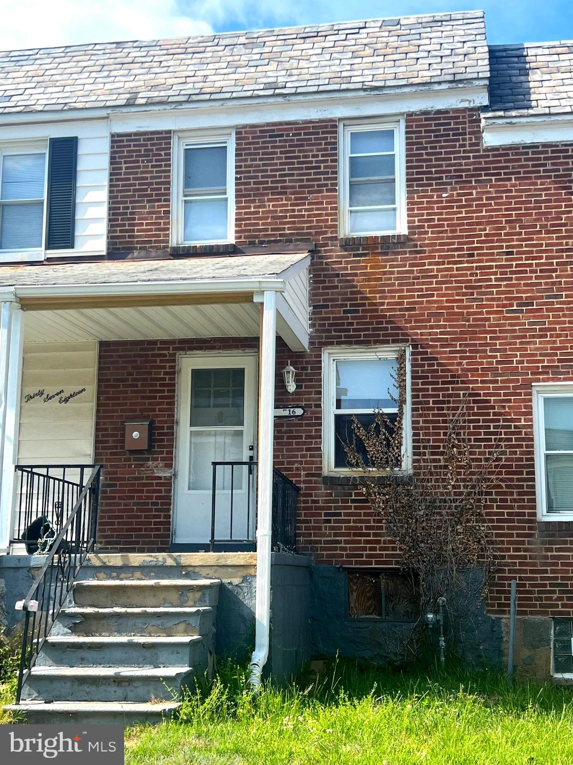 3716 Flowerton Road Baltimore, MD 21229 - Photo 2 of 12 a front view of a house with a garden