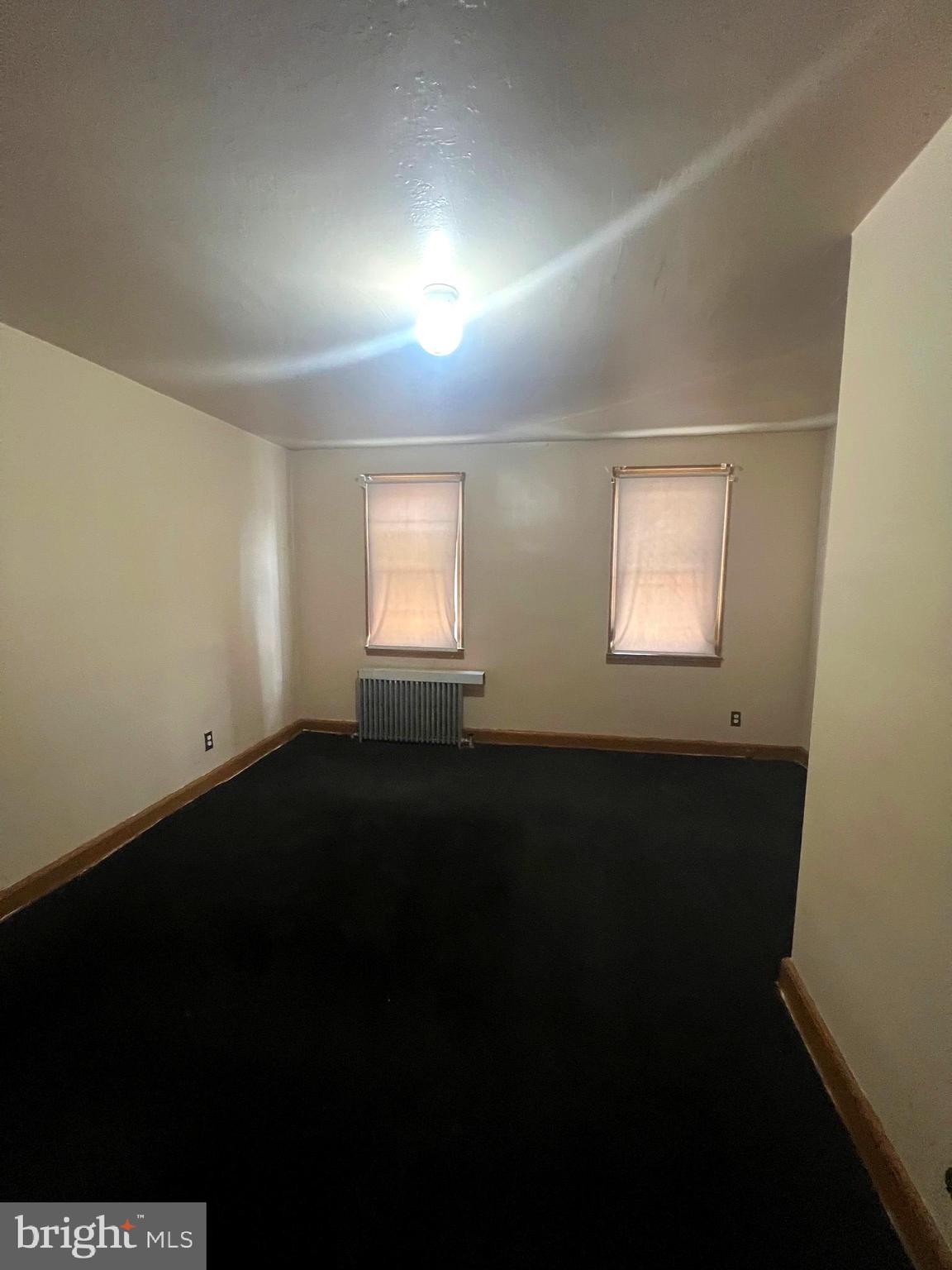 3716 Flowerton Road Baltimore, MD 21229 - Photo 6 of 12 a view of an empty room and window